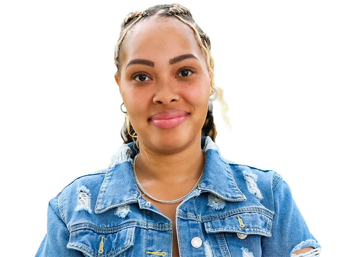 Young smiling Black woman with blonde braid accents wearing a jean jacket